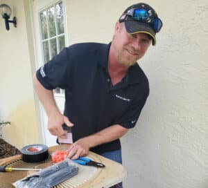 Owner Brian Lucas Working Repairing an AC unit