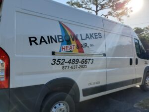 Rainbow Lakes Heating and Air Conditioning truck sitting in the summer sun.