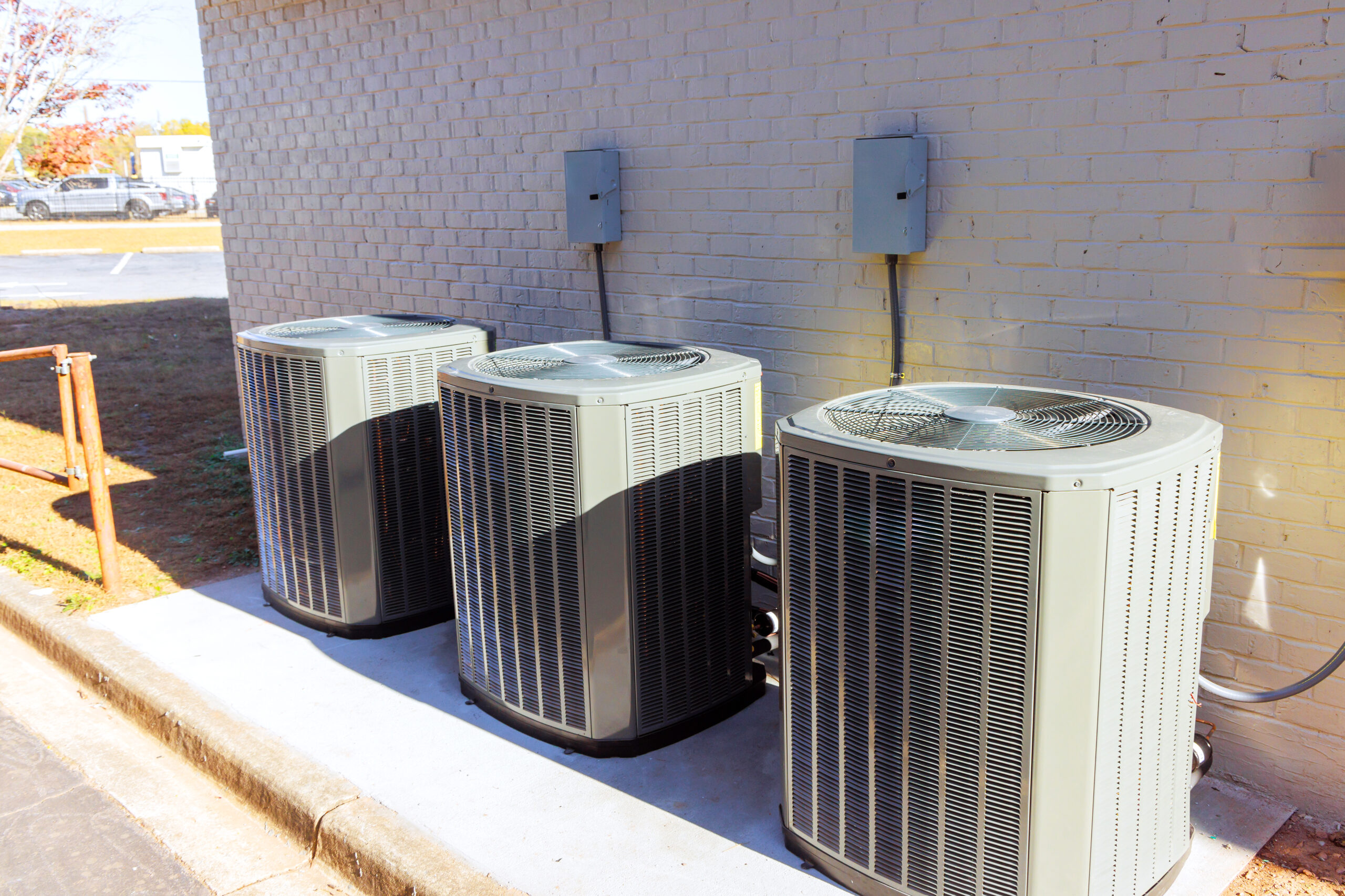 An outdoor air conditioning units has been installed on exterior facade of a new busines